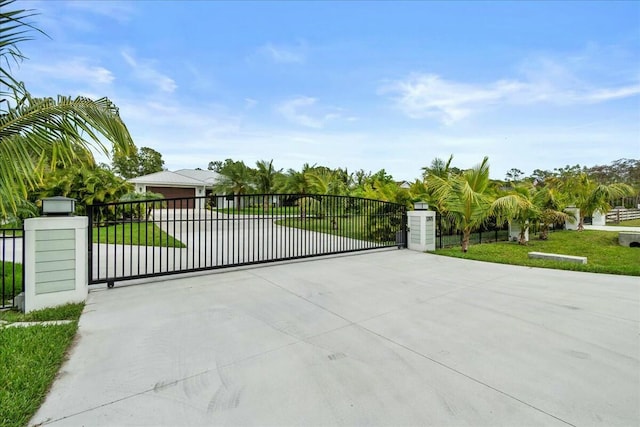 view of gate featuring a lawn