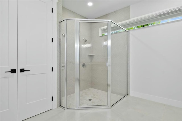 full bathroom with recessed lighting and a shower stall