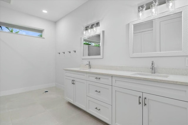 full bathroom with recessed lighting, a sink, baseboards, and double vanity