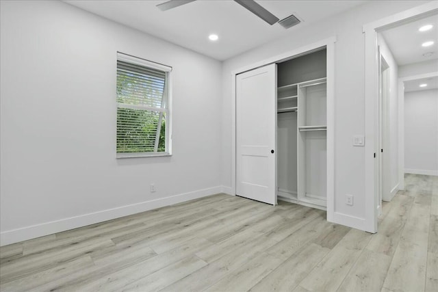 unfurnished bedroom with baseboards, visible vents, light wood-type flooring, a closet, and recessed lighting