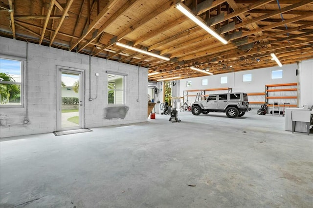 garage with concrete block wall