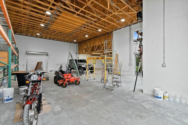 garage with concrete block wall