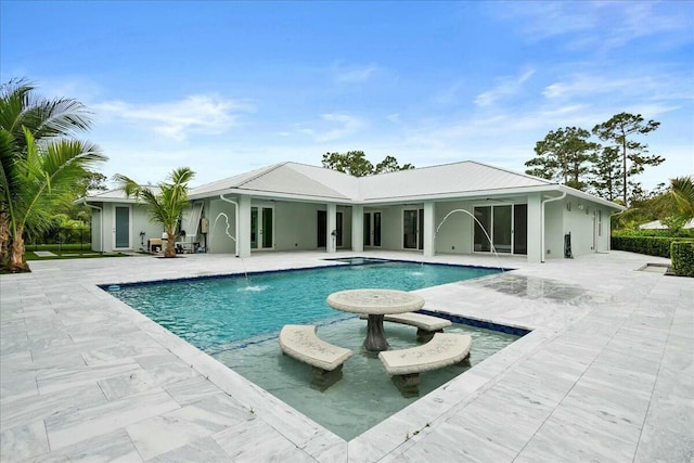 pool featuring a patio area