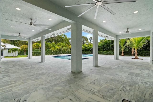 view of patio / terrace featuring fence and an outdoor pool