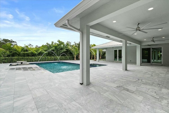 view of swimming pool featuring a fenced in pool, french doors, a patio area, and ceiling fan