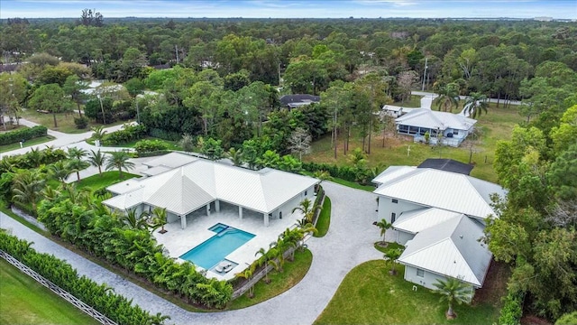 drone / aerial view with a view of trees