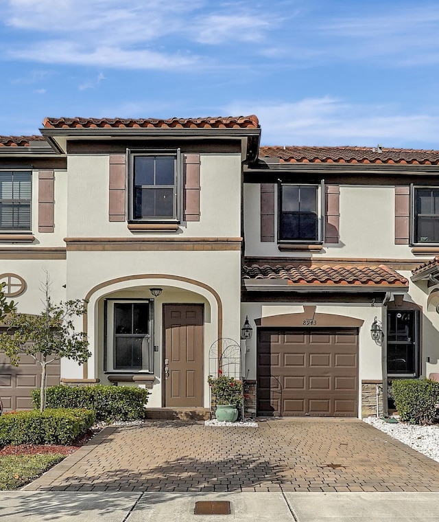 mediterranean / spanish-style home featuring a garage