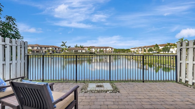 view of patio / terrace with a water view