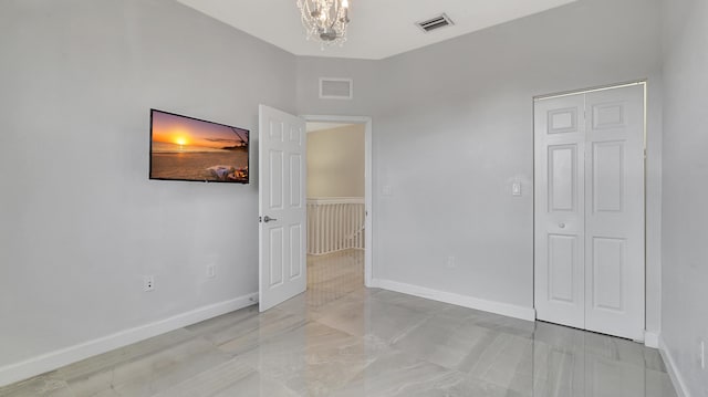 empty room with a chandelier