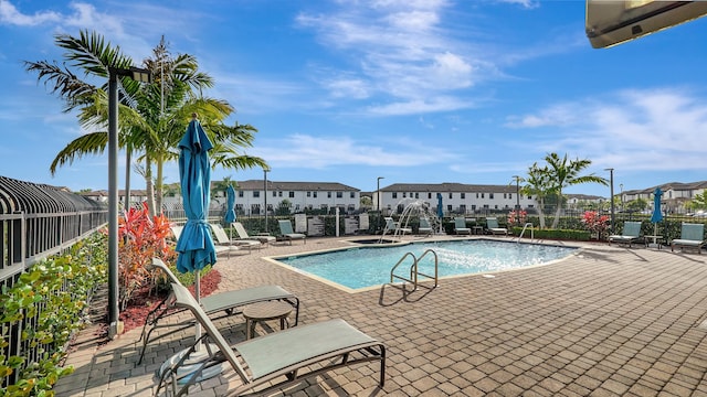 view of swimming pool with a patio