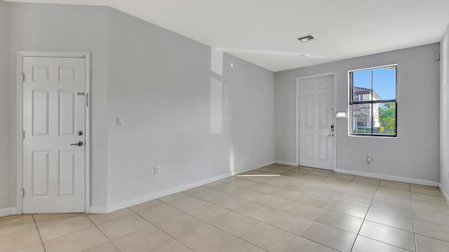 foyer entrance featuring light tile patterned floors