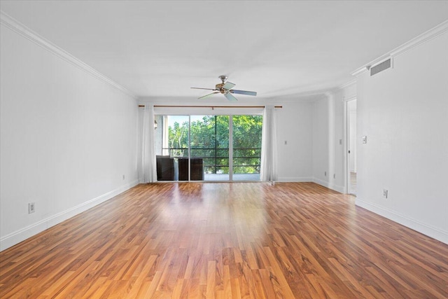 spare room with crown molding, hardwood / wood-style floors, and ceiling fan