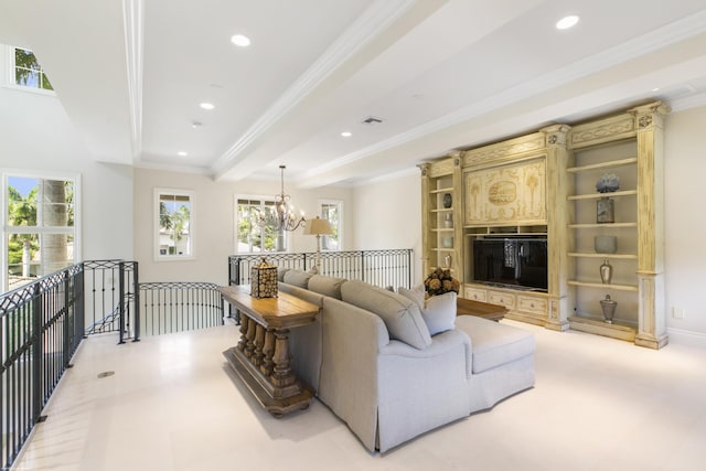 living room with beam ceiling, ornamental molding, and an inviting chandelier