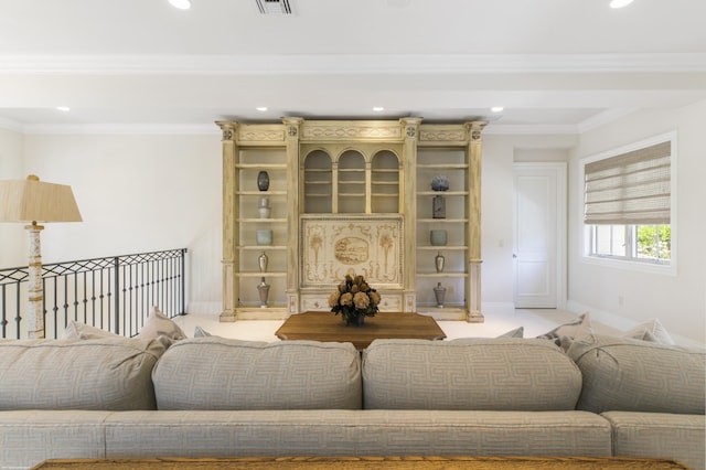 living room with ornamental molding