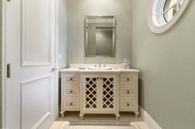 bathroom with vanity and crown molding