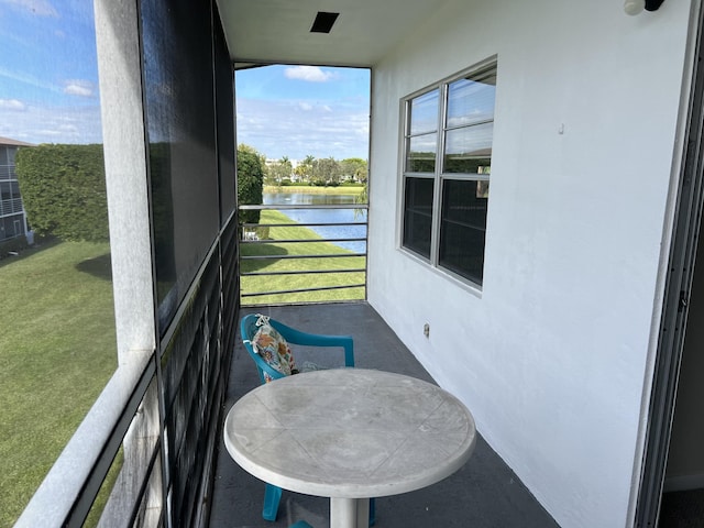 balcony featuring a water view