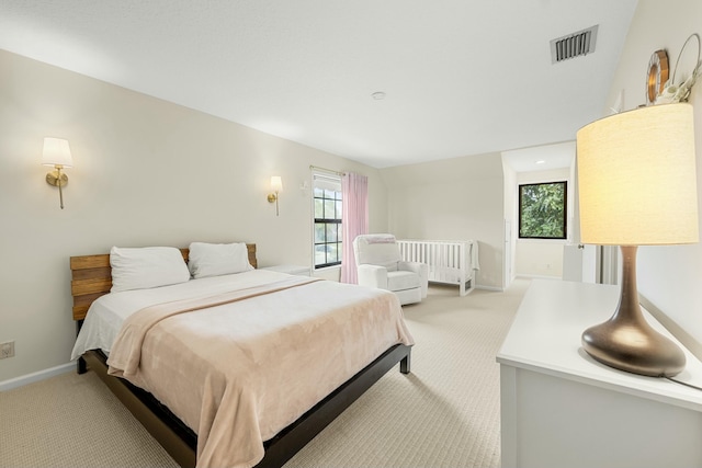 bedroom with light colored carpet