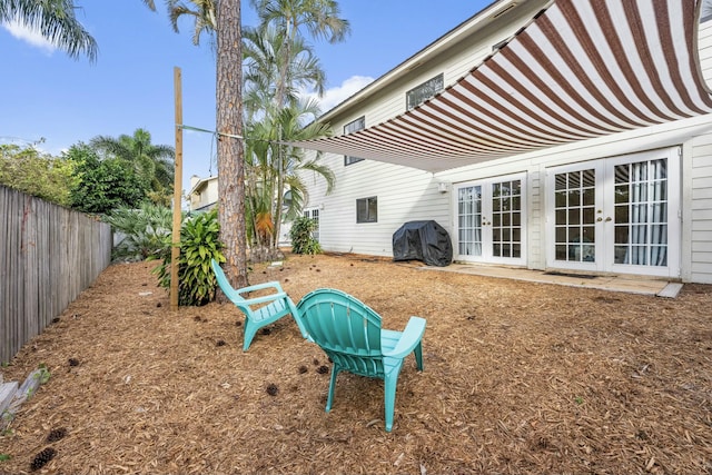 view of yard featuring french doors