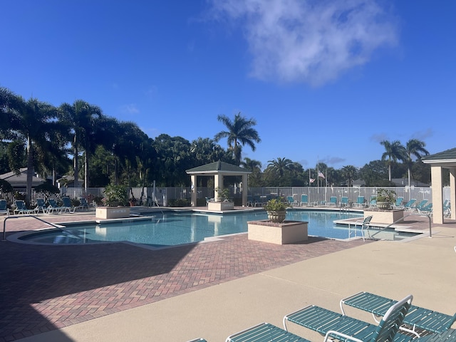 view of swimming pool featuring a gazebo and a patio