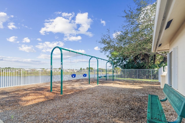 view of jungle gym featuring a water view