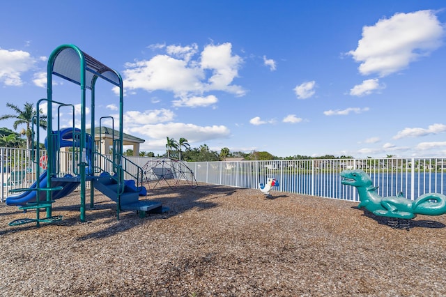 view of jungle gym featuring a water view