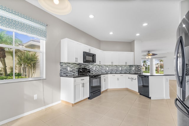 kitchen with white cabinets, decorative backsplash, ceiling fan, and black appliances