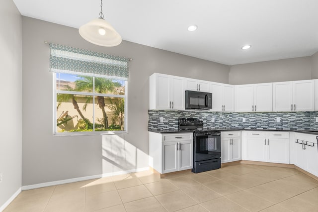 kitchen featuring black appliances, pendant lighting, light tile patterned floors, and backsplash