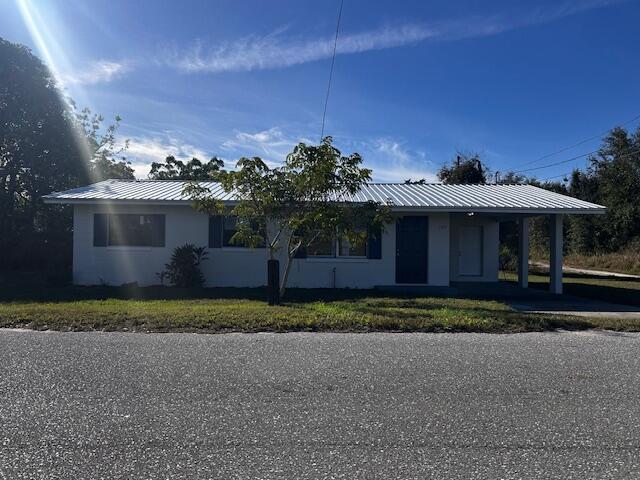 ranch-style house with a carport