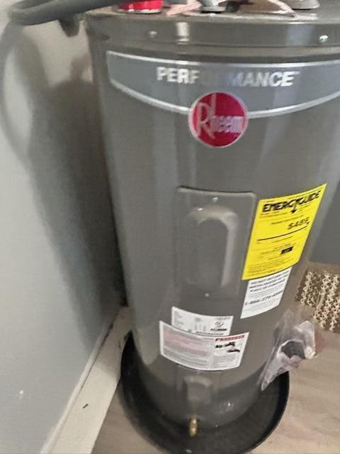 utility room with water heater