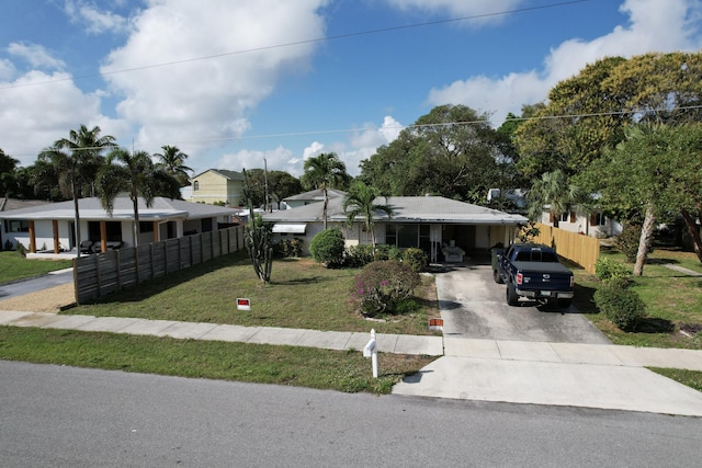 single story home with a carport and a front lawn