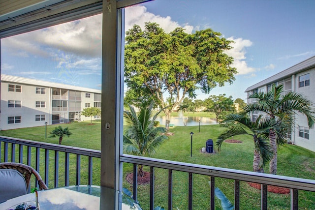 balcony featuring a water view