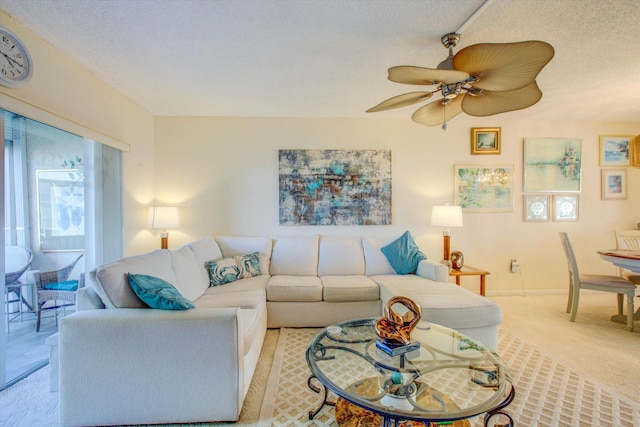 carpeted living room with a textured ceiling and ceiling fan