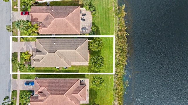 birds eye view of property featuring a water view