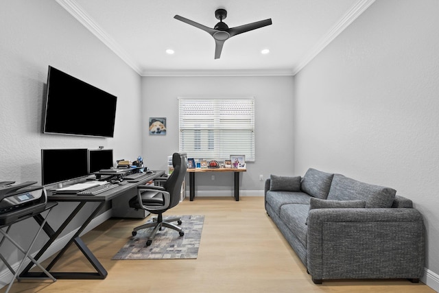 home office featuring ceiling fan, light wood-type flooring, and ornamental molding