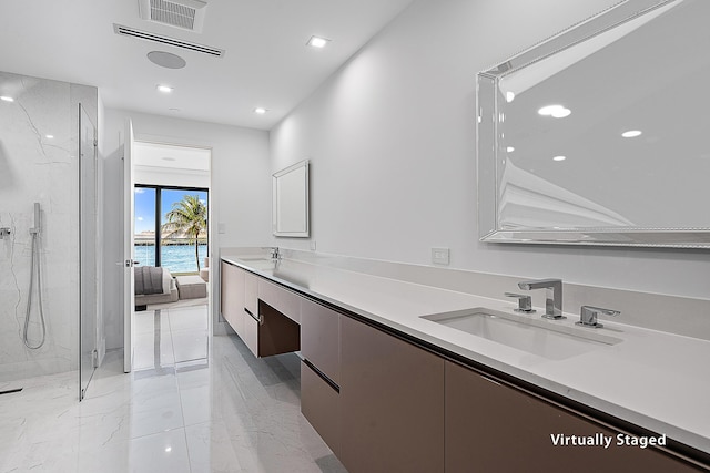 bathroom with visible vents, marble finish floor, a sink, a marble finish shower, and double vanity