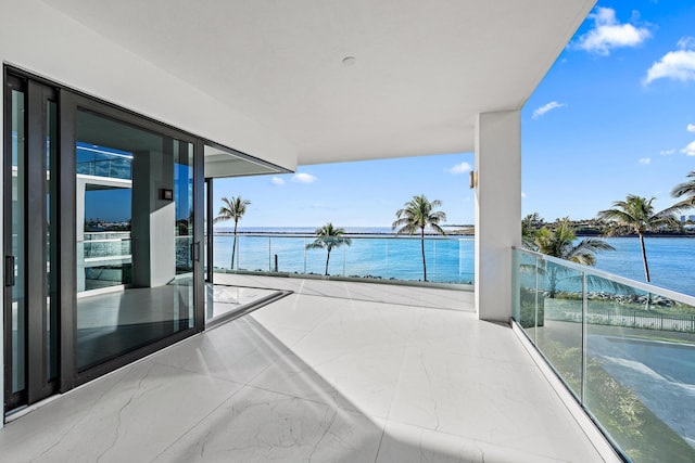 balcony featuring a water view