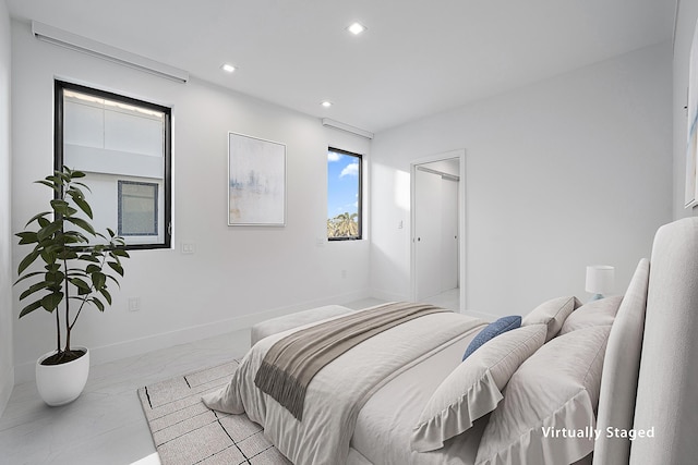 bedroom with recessed lighting, baseboards, and marble finish floor