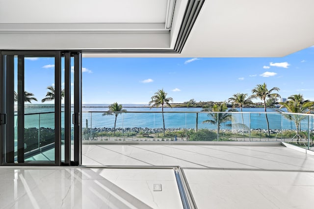 balcony featuring a water view