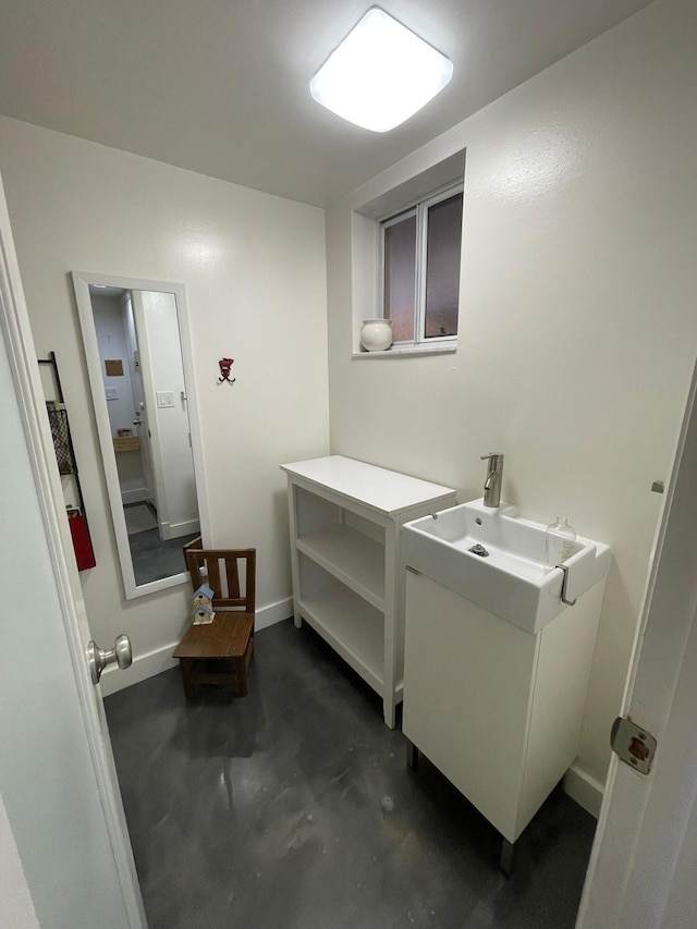 bathroom featuring vanity and concrete floors