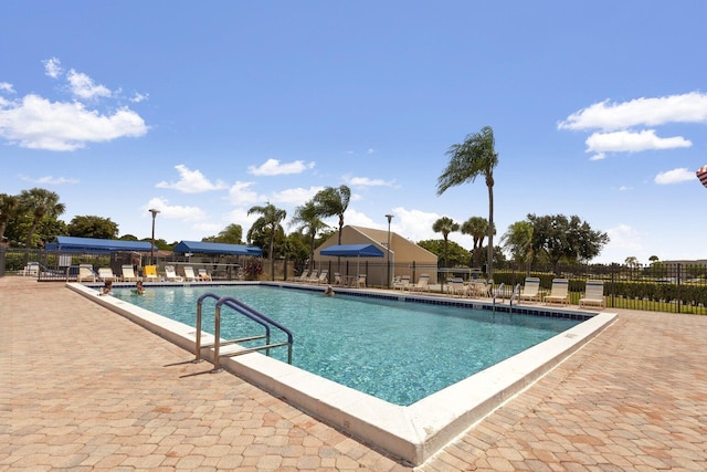 view of swimming pool featuring a patio area