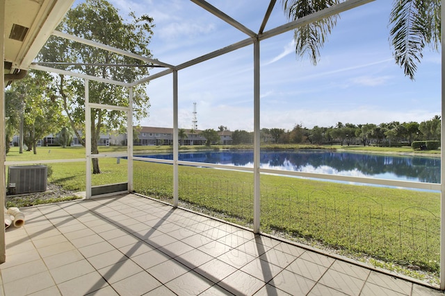 unfurnished sunroom with a water view