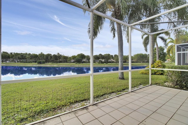 unfurnished sunroom with a water view