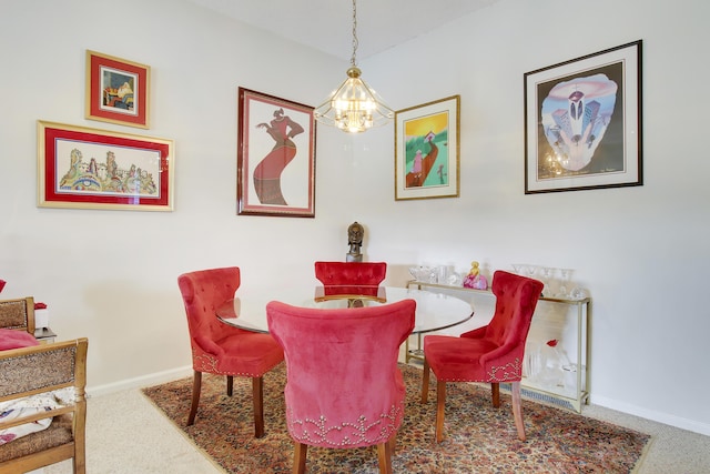 dining area featuring carpet and an inviting chandelier