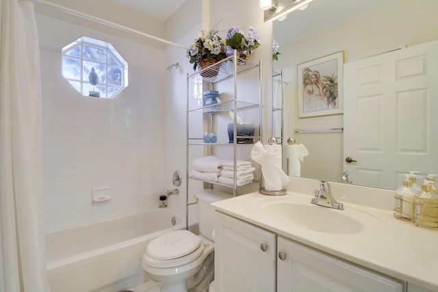 full bathroom with shower / tub combo with curtain, vanity, and toilet