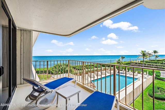 balcony featuring a water view