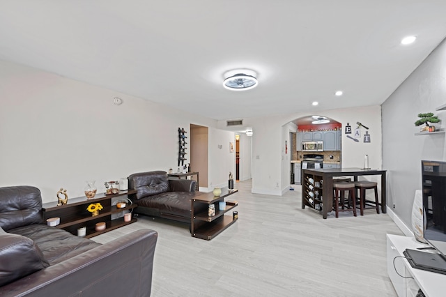 living room featuring light wood-type flooring