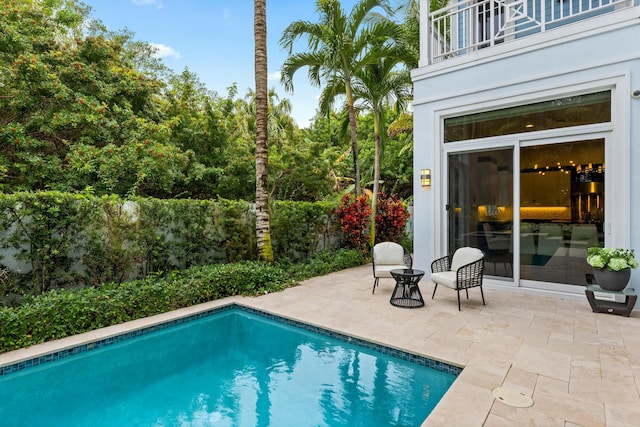 view of pool featuring a patio area