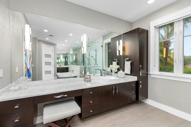 bathroom with vanity and an enclosed shower