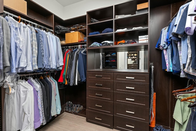 walk in closet featuring light tile patterned floors