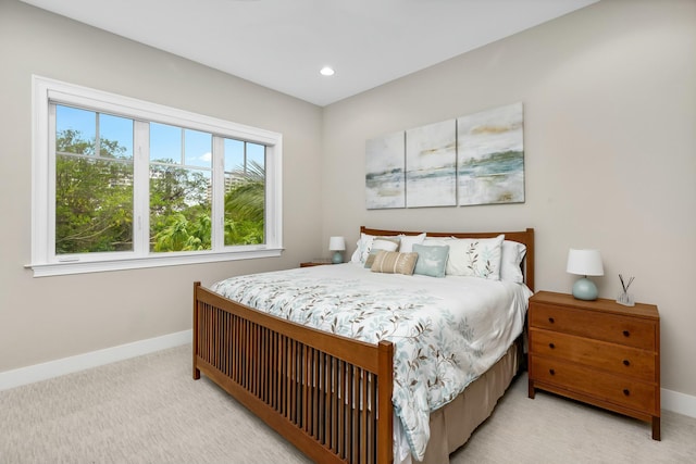 bedroom with light colored carpet